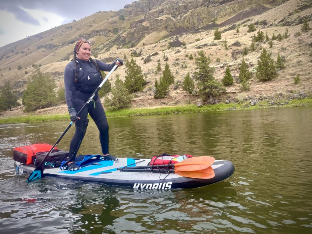 Sam on the water in a wetsuit