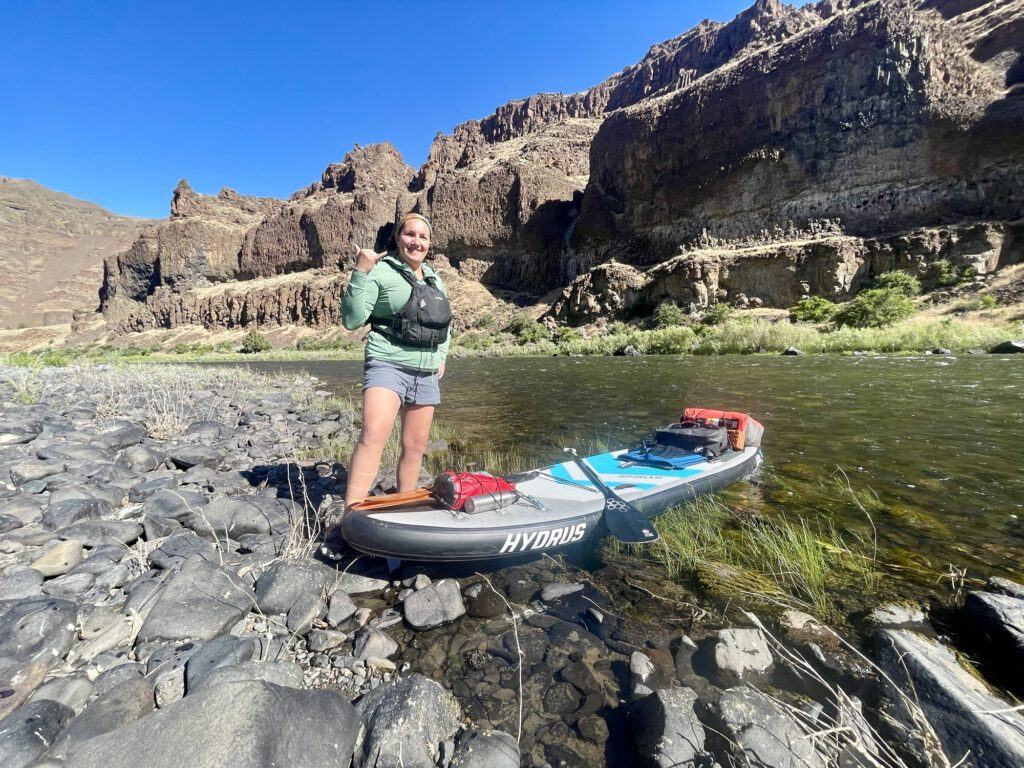 Sam next to her board