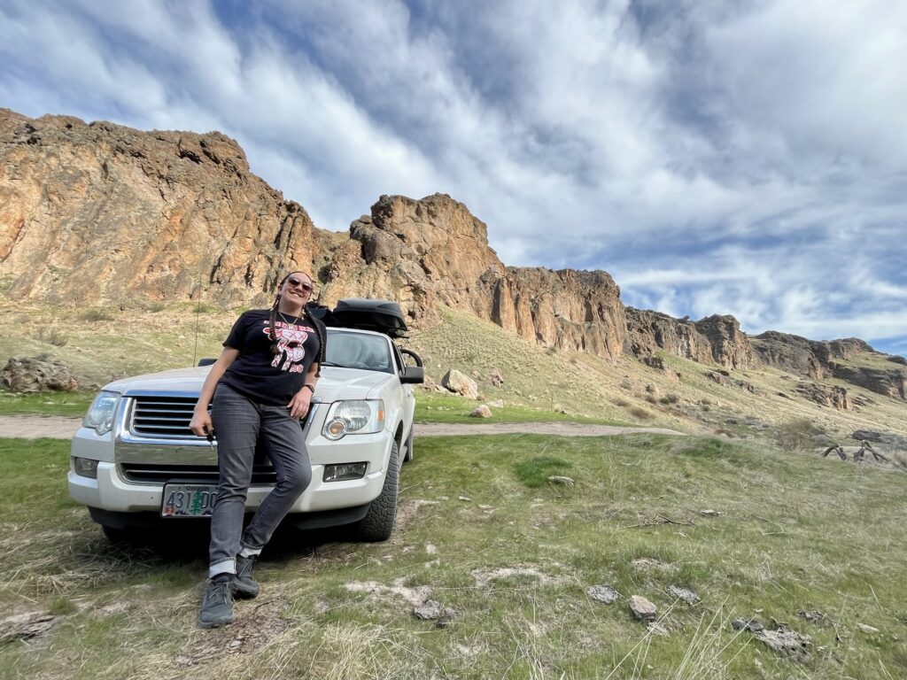Sam on hood of car at campground