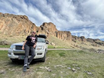 Sam on hood of car at campground