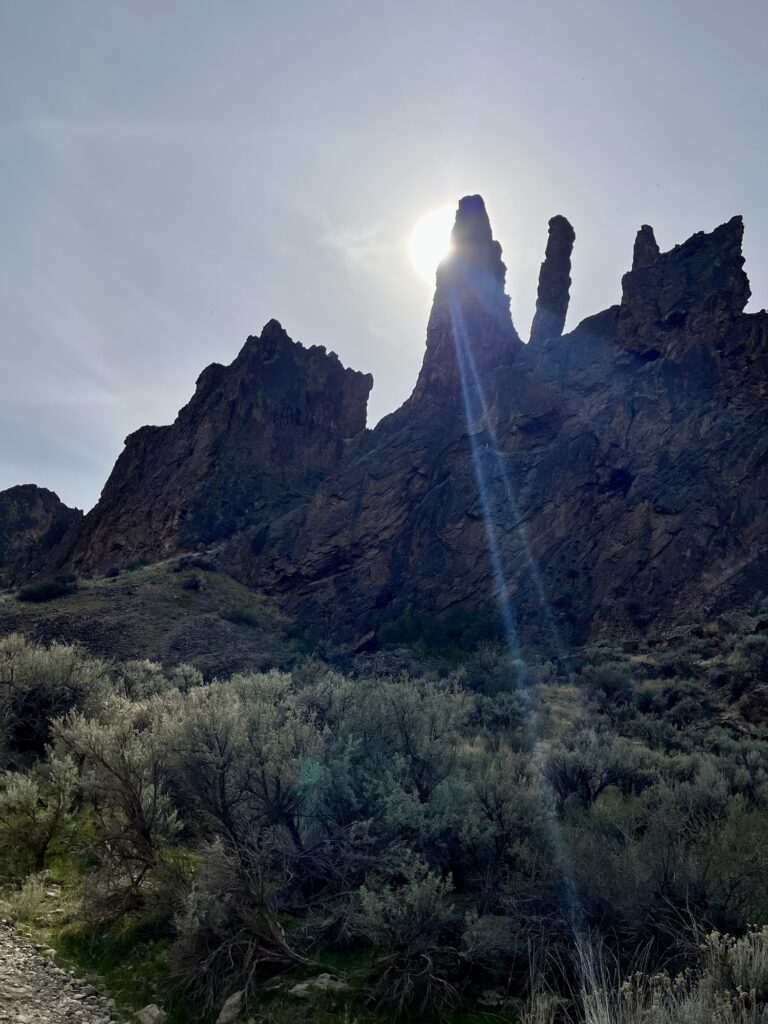 sun behind the cliffs