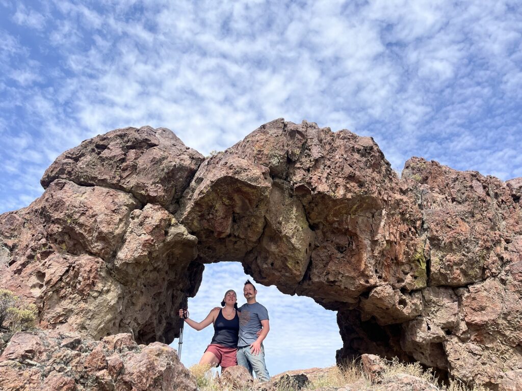 Us under a rock arch