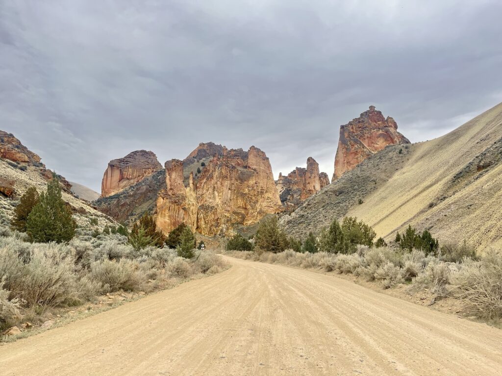 Road leading to red rock cliffs