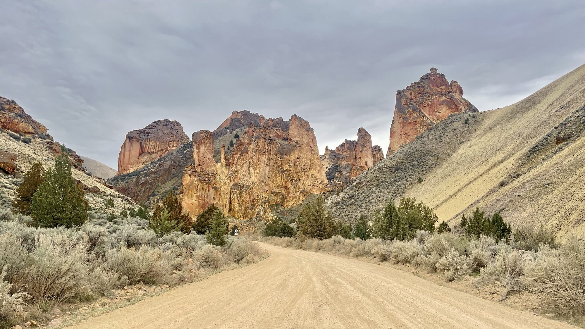 Road leading to red rock cliffs
