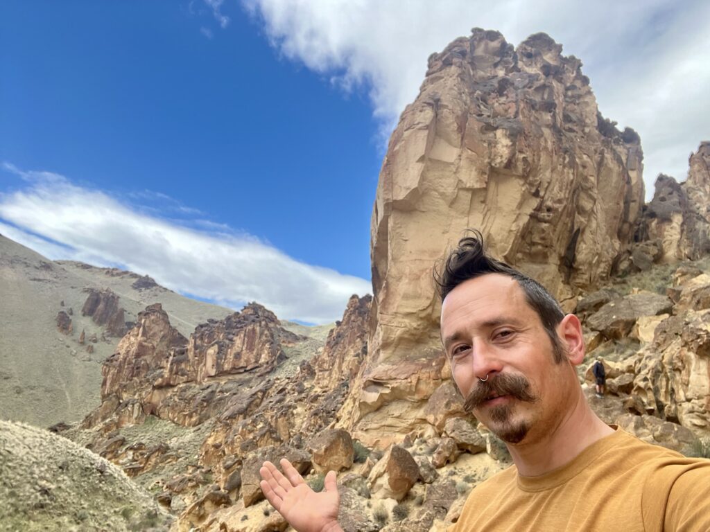 Me in front of the red rock cliffs